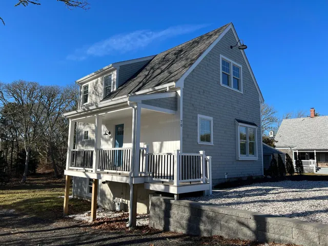 a front view of a house with large windows