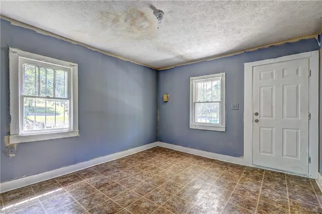 a view of an empty room and window