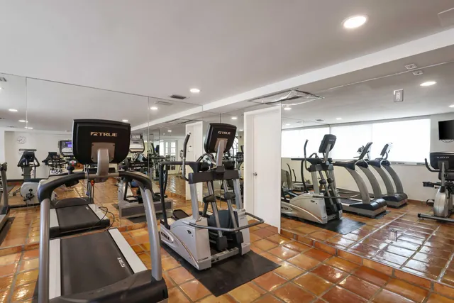 a view of a room with gym equipment