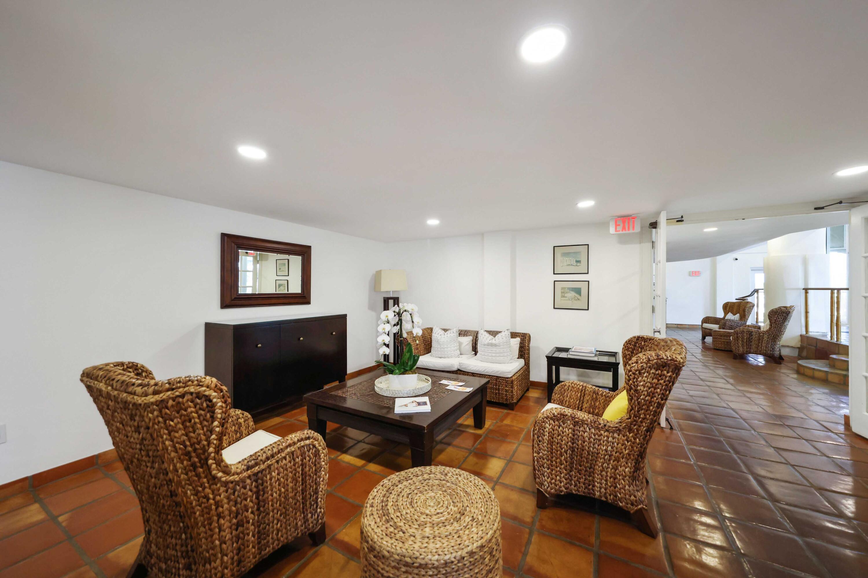 139 Sunrise Avenue, Unit 1040 Palm Beach, FL 33480 - Photo 30 of 43 a living room with furniture and a wooden floor