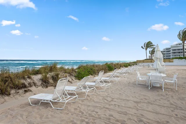 a view of a lake with outdoor seating space