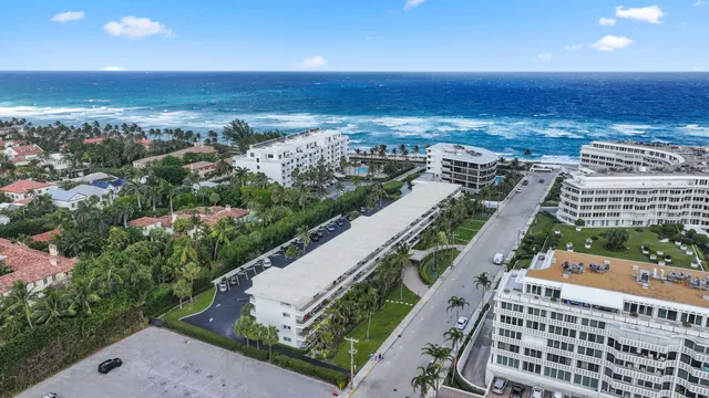 an aerial view of city and ocean