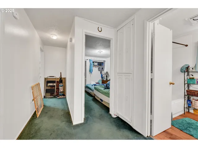 a bedroom with a bed and a book shelf