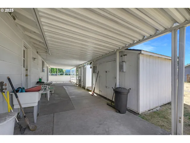 a view of a house with a yard and a garage
