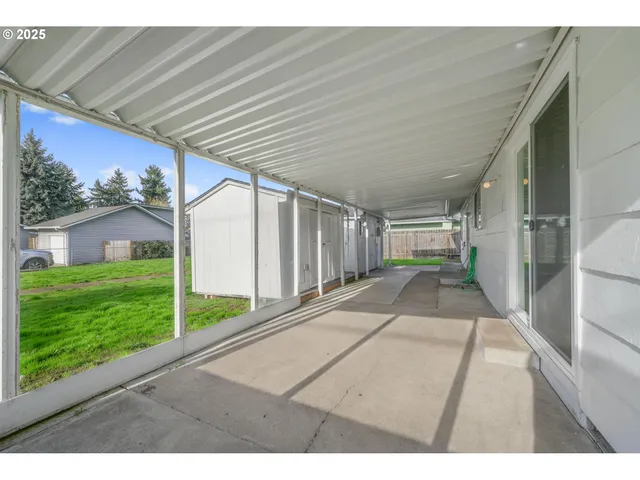 a view of a backyard with large trees