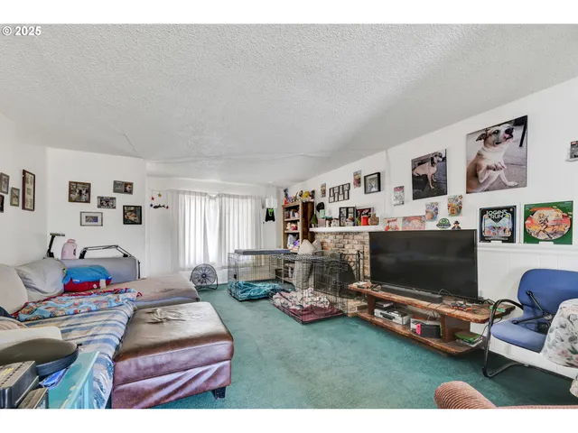 a kitchen with refrigerator and cabinets
