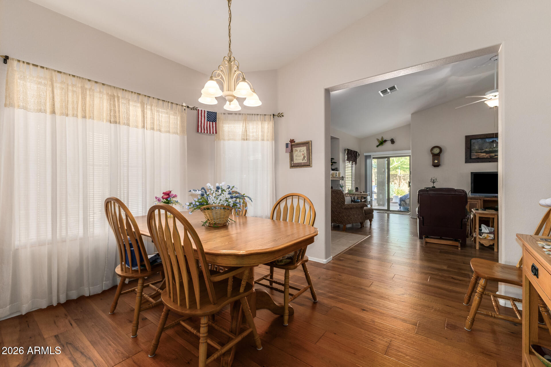 3448 West Webster Court Anthem, AZ 85086 - Photo 10 of 40 a view of a a dining room with furniture window and wooden floor