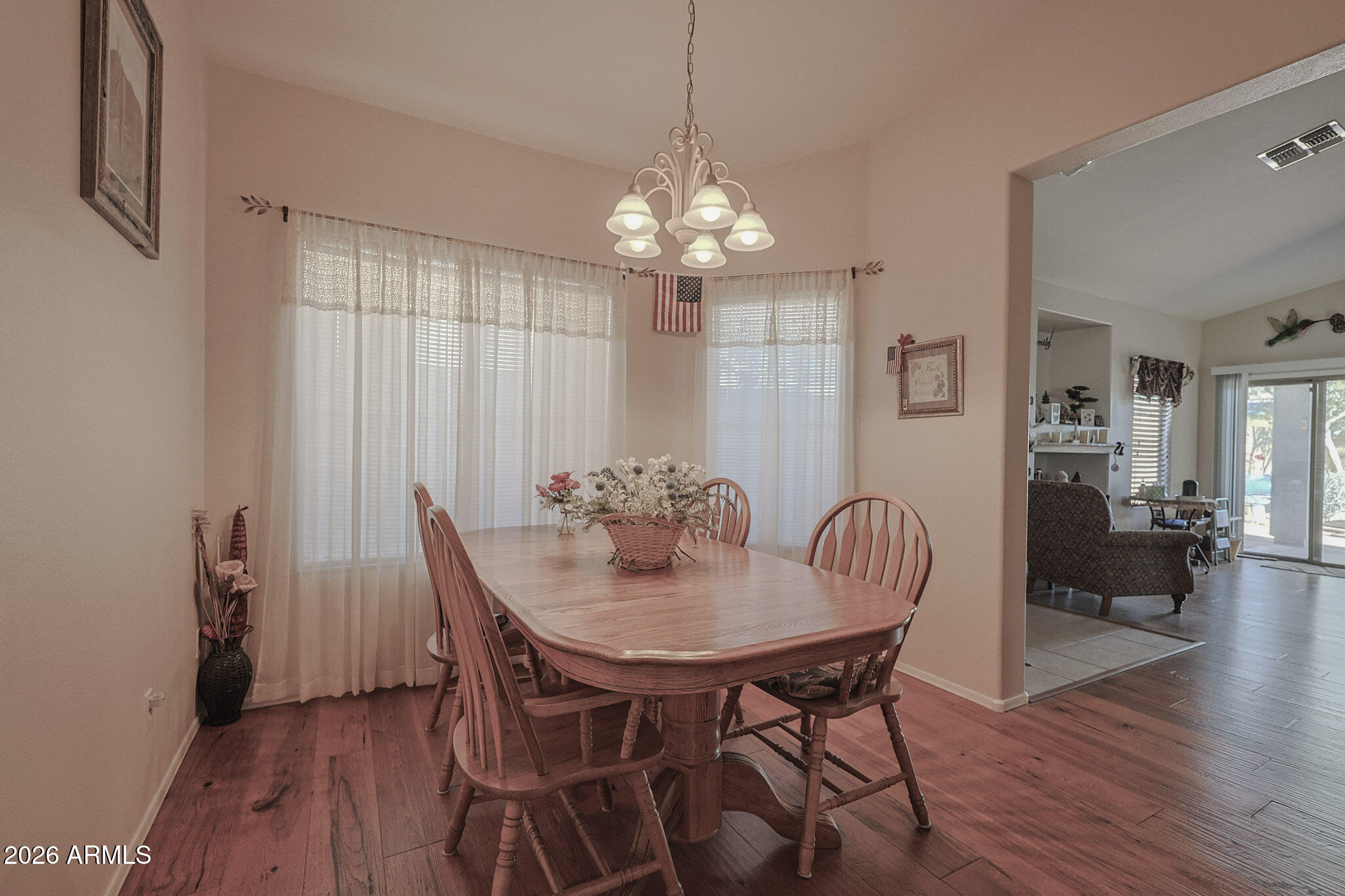 3448 West Webster Court Anthem, AZ 85086 - Photo 11 of 40 a view of a dining room with furniture window and wooden floor