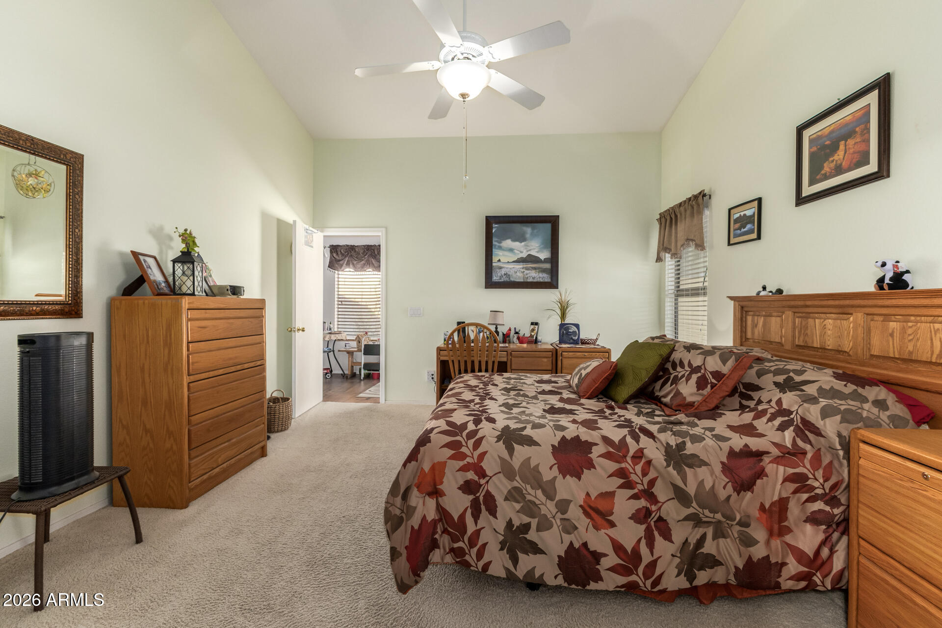 3448 West Webster Court Anthem, AZ 85086 - Photo 15 of 40 a bedroom with bed and a chandelier