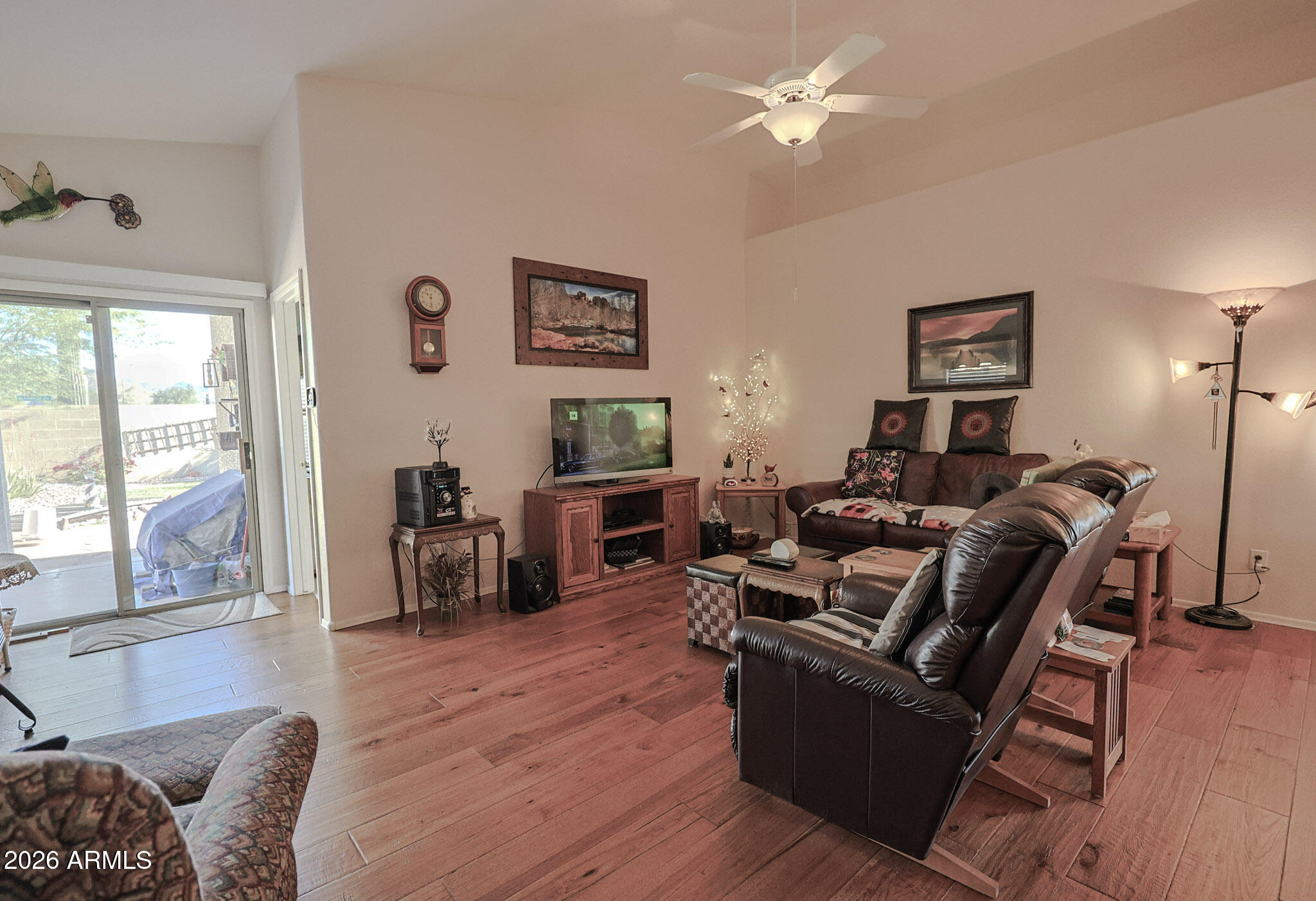3448 West Webster Court Anthem, AZ 85086 - Photo 9 of 40 a living room with furniture two window and wooden floor