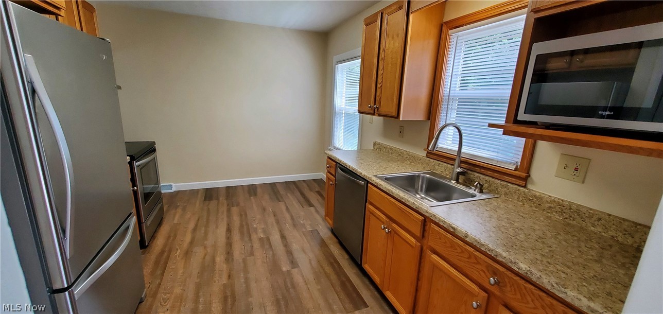 1770 Beryl Road Akron, OH 44312 - Photo 10 of 21 Galley Kitchen with the new wood floor