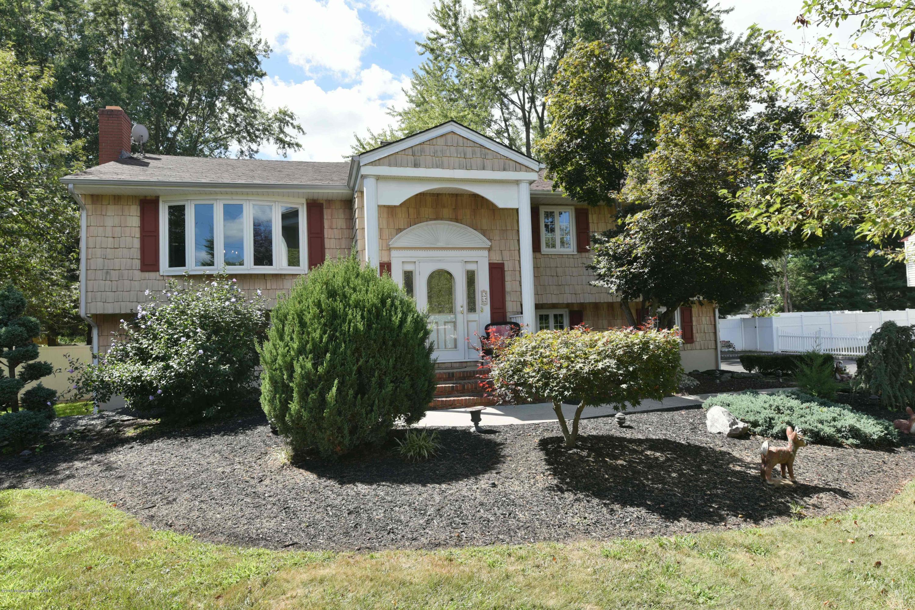 22 Walling Road Freehold, NJ 07728 - Photo 1 of 36 a front view of a house with garden
