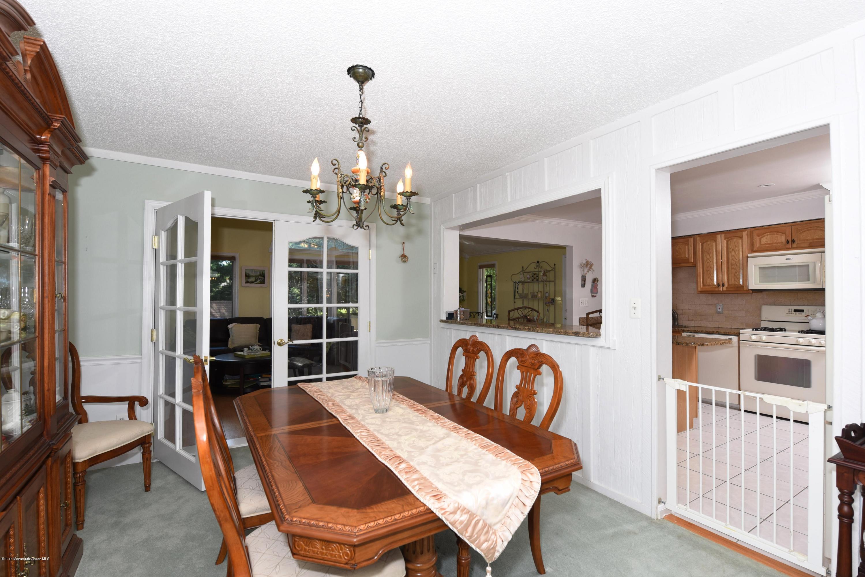 22 Walling Road Freehold, NJ 07728 - Photo 12 of 36 a view of a dining room with furniture and chandelier