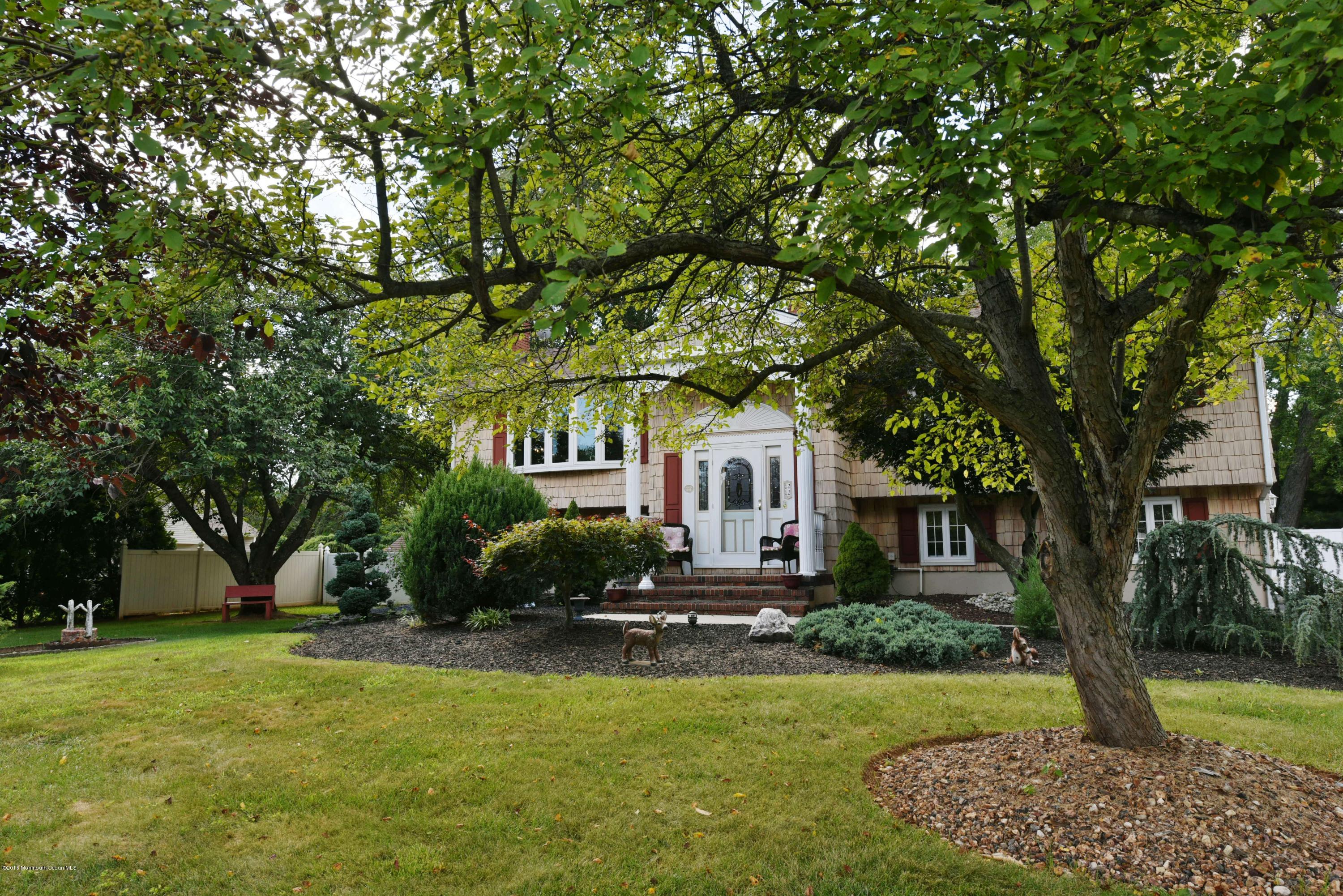 22 Walling Road Freehold, NJ 07728 - Photo 4 of 36 a front view of a house with a yard