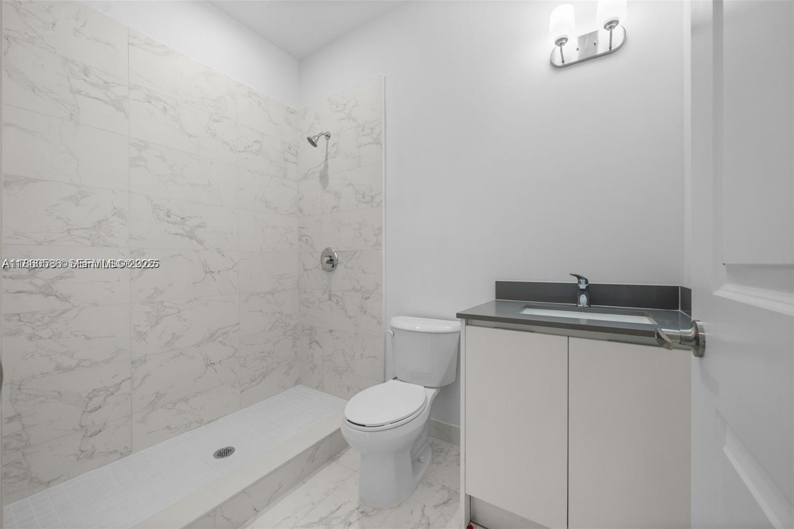 18970 Southwest 345th Terrace Homestead, FL 33034 - Photo 11 of 20 a bathroom with a shower a toilet and a sink