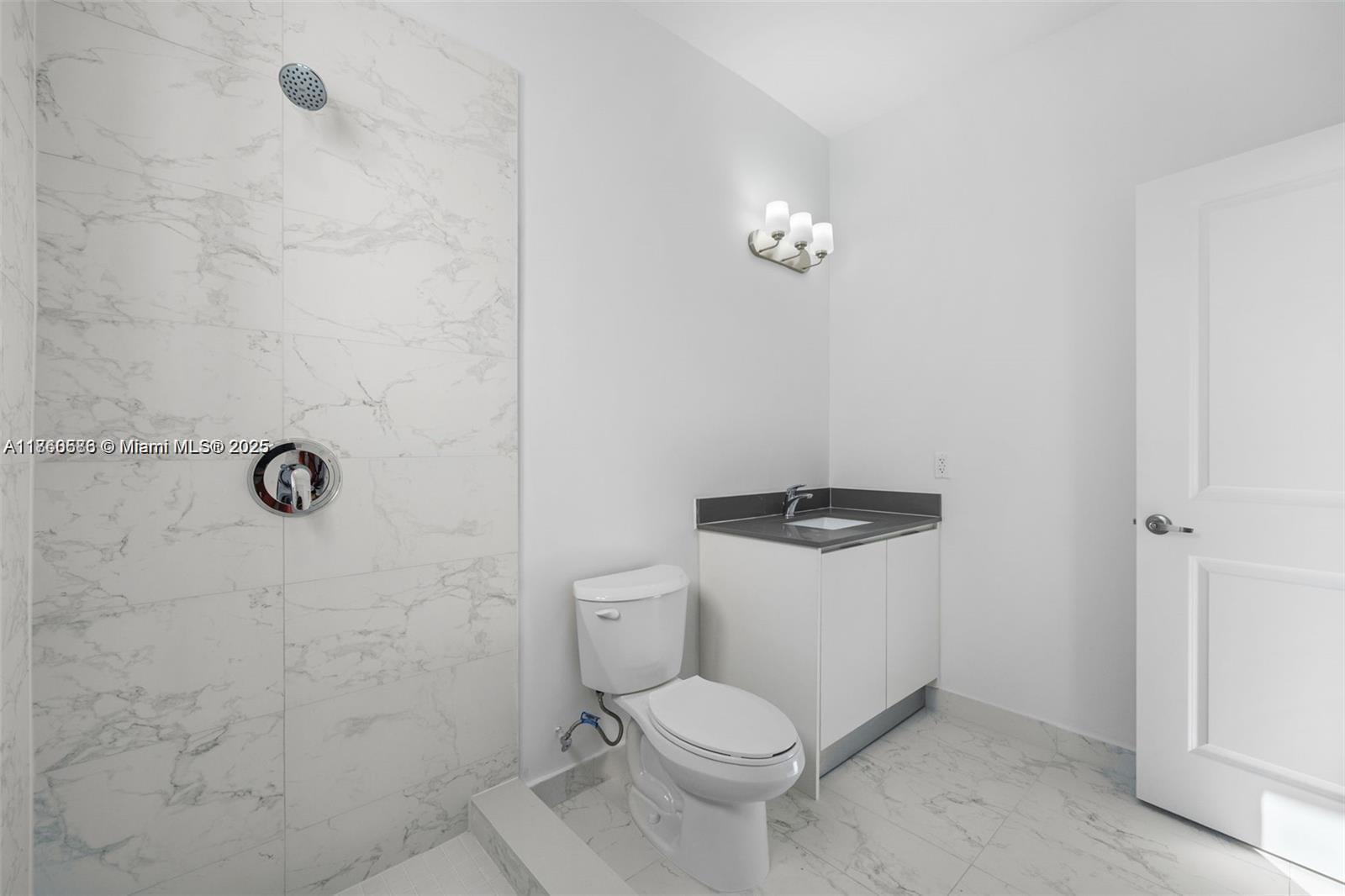 18970 Southwest 345th Terrace Homestead, FL 33034 - Photo 12 of 19 a white toilet sitting next to a shower