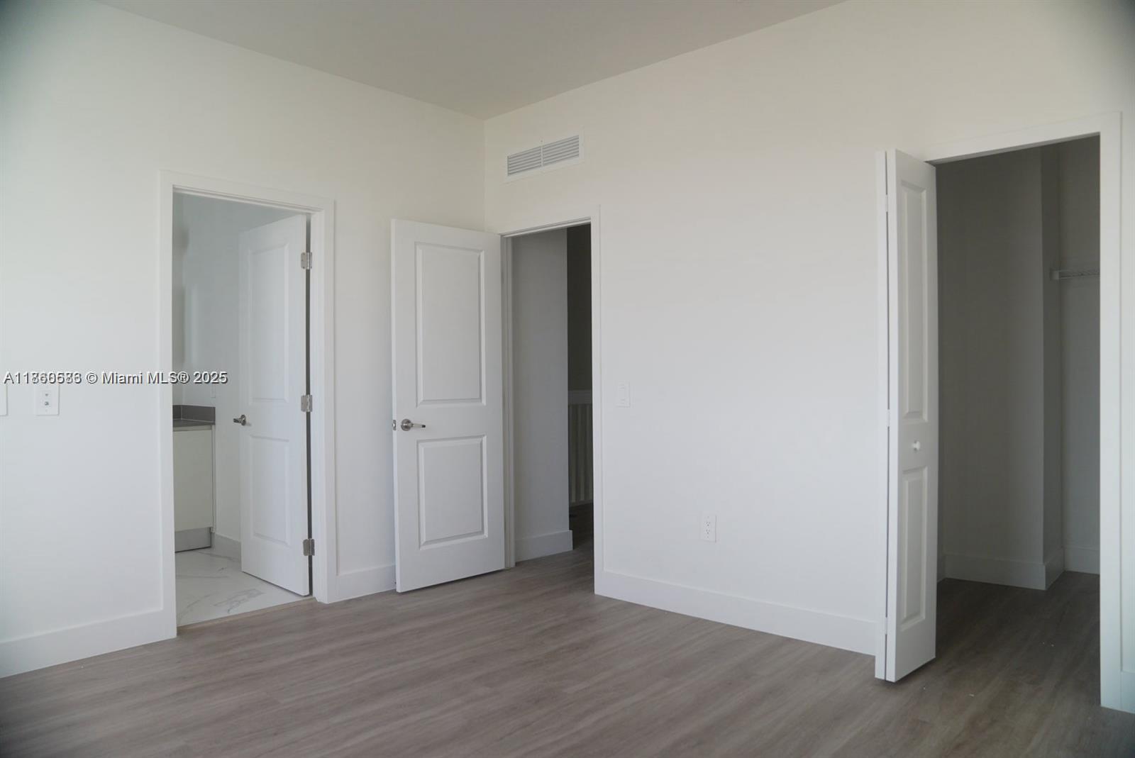 18970 Southwest 345th Terrace Homestead, FL 33034 - Photo 14 of 19 a view of an empty room with wooden floor