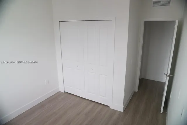 a view of small space with wooden floor