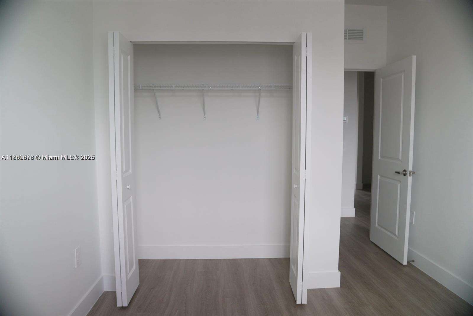 18970 Southwest 345th Terrace Homestead, FL 33034 - Photo 16 of 19 a view of a hallway with wooden floor