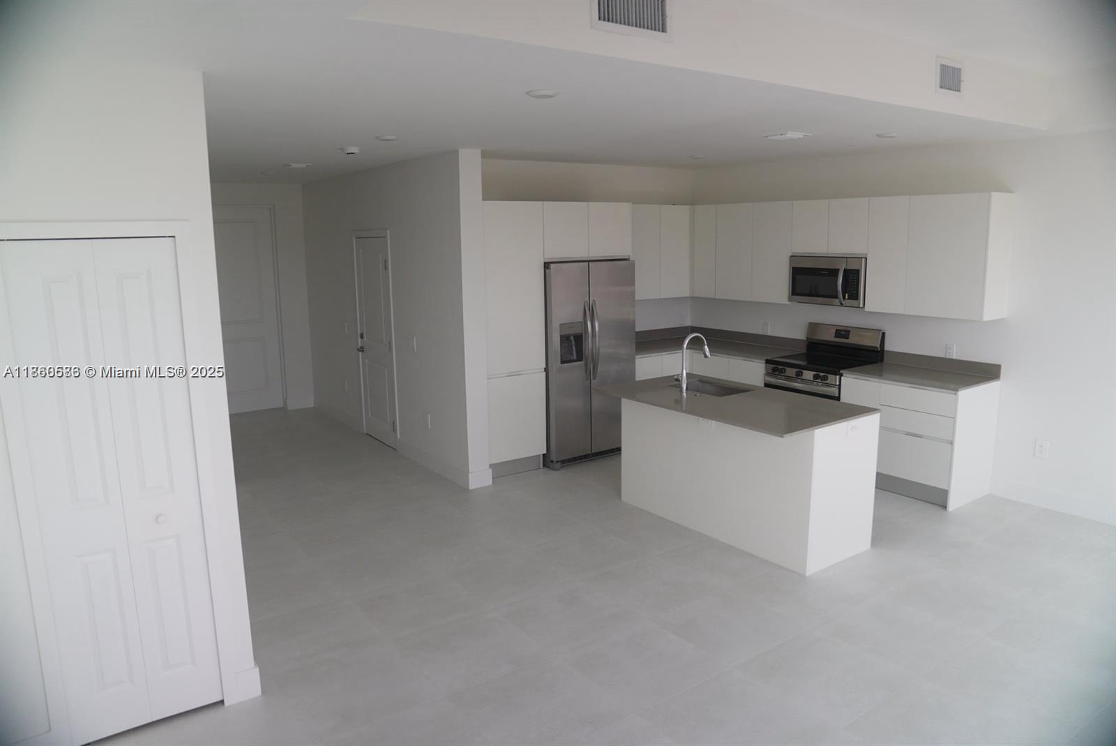 18970 Southwest 345th Terrace Homestead, FL 33034 - Photo 5 of 19 a kitchen with a sink cabinets and stainless steel appliances