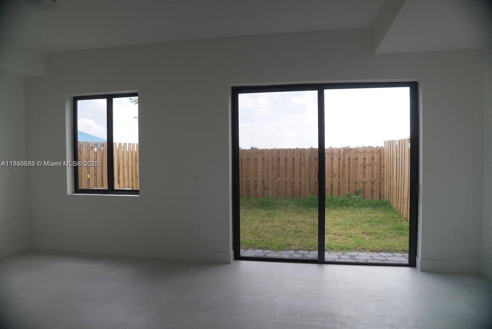 18970 Southwest 345th Terrace Homestead, FL 33034 - Photo 7 of 19 a view of an empty room with window