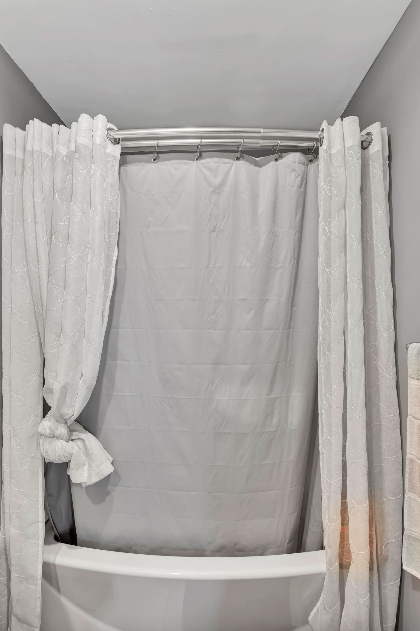 108 8th Avenue Columbia, TN 38401 - Photo 13 of 30 a bathroom with a shower curtain and a curtain