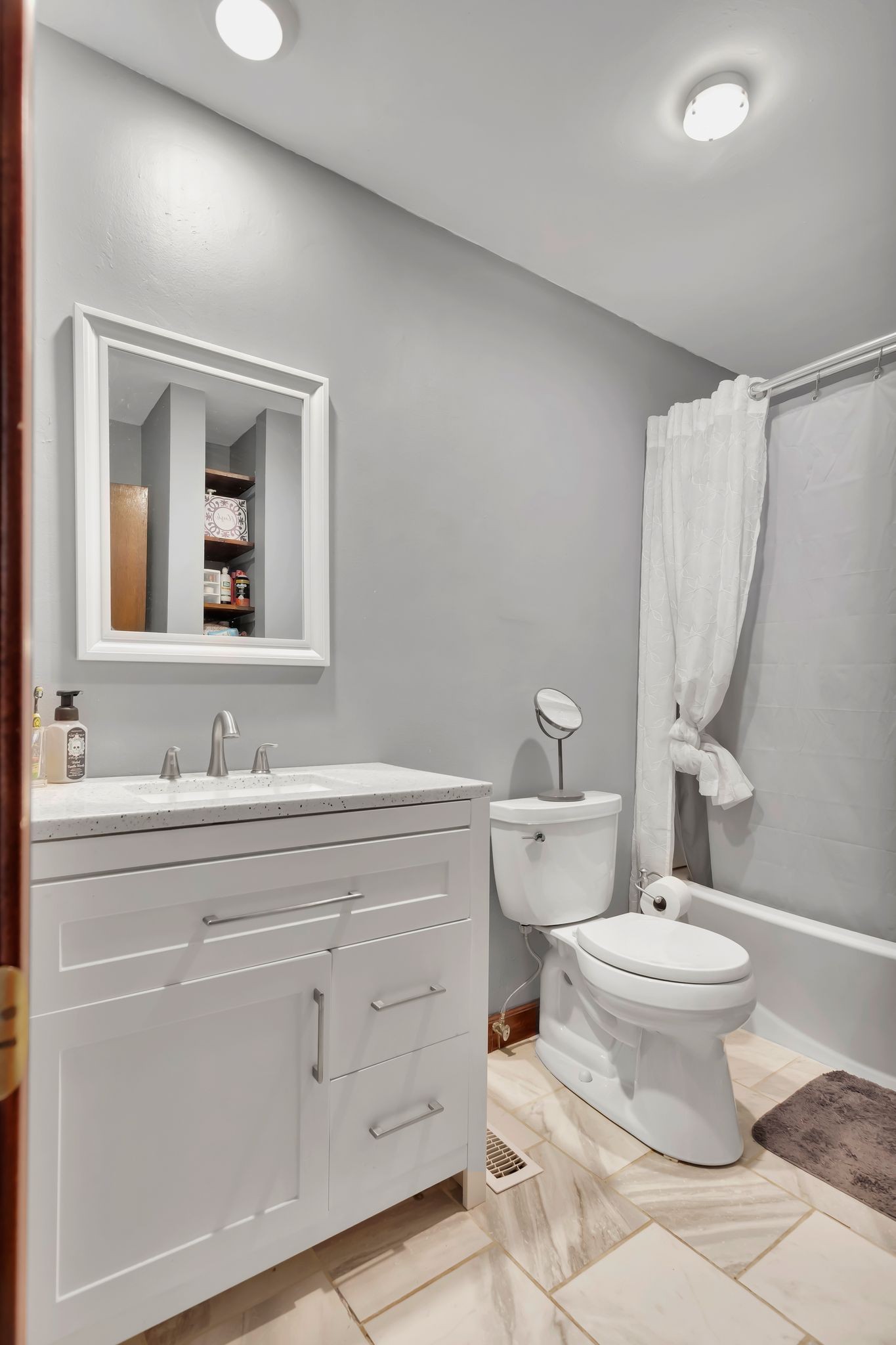108 8th Avenue Columbia, TN 38401 - Photo 14 of 30 a bathroom with a toilet sink and mirror