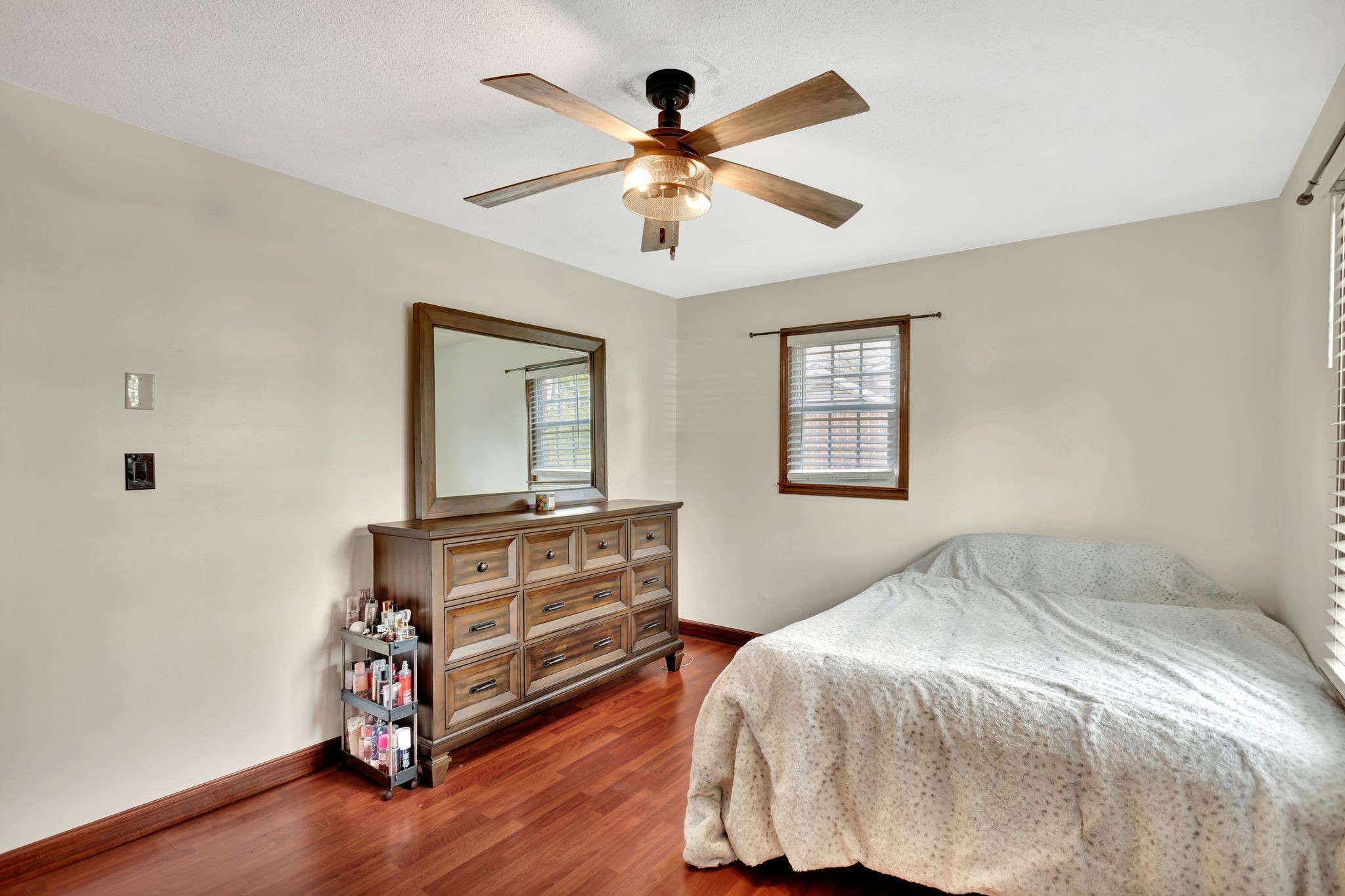 108 8th Avenue Columbia, TN 38401 - Photo 20 of 30 a bedroom with a bed and a chandelier