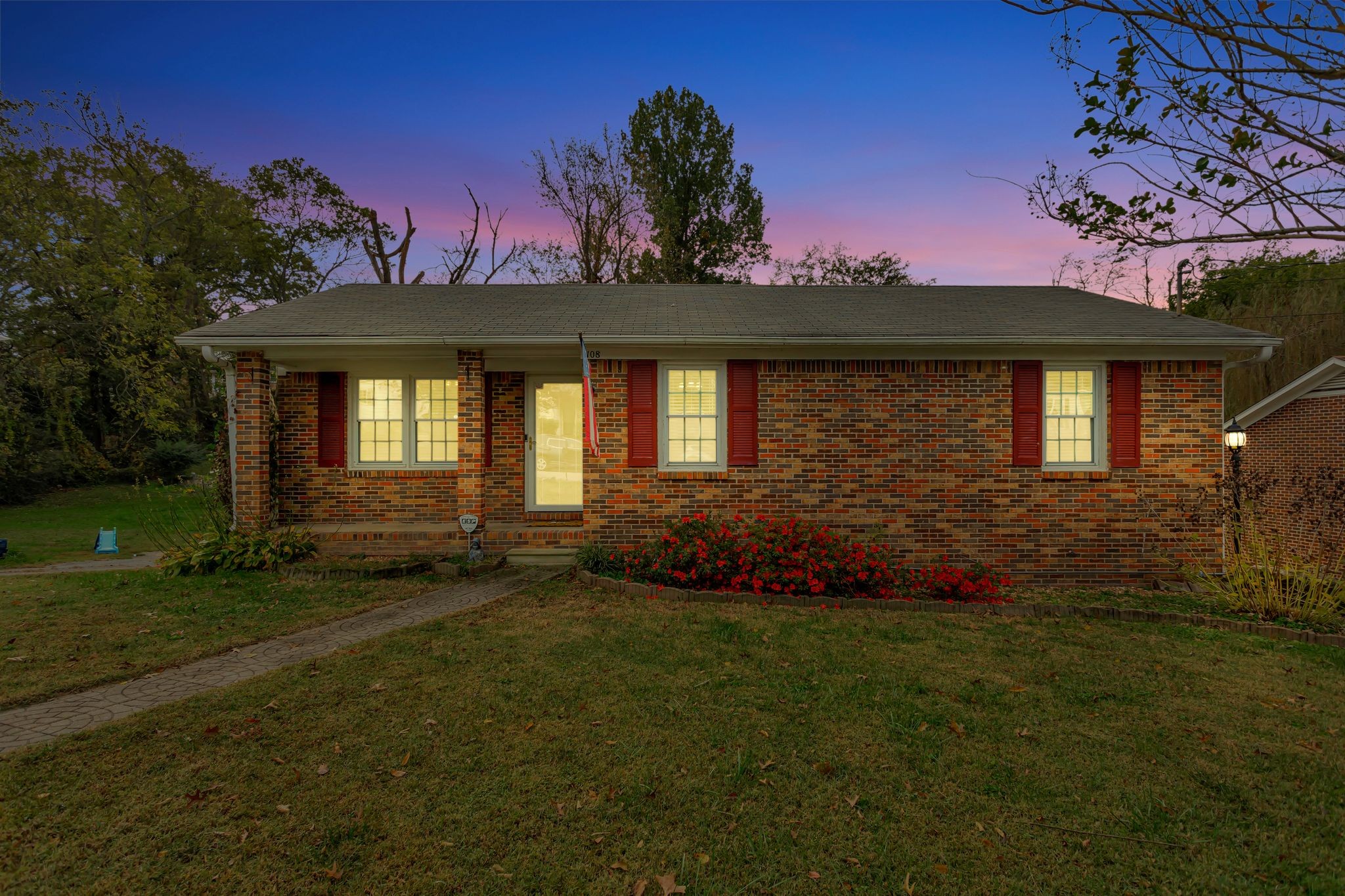 108 8th Avenue Columbia, TN 38401 - Photo 2 of 30 a front view of a house with a garden