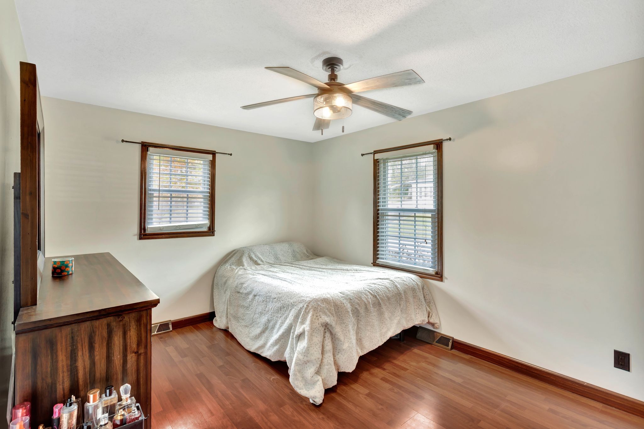 108 8th Avenue Columbia, TN 38401 - Photo 21 of 30 a bed sitting in a bedroom next to a window