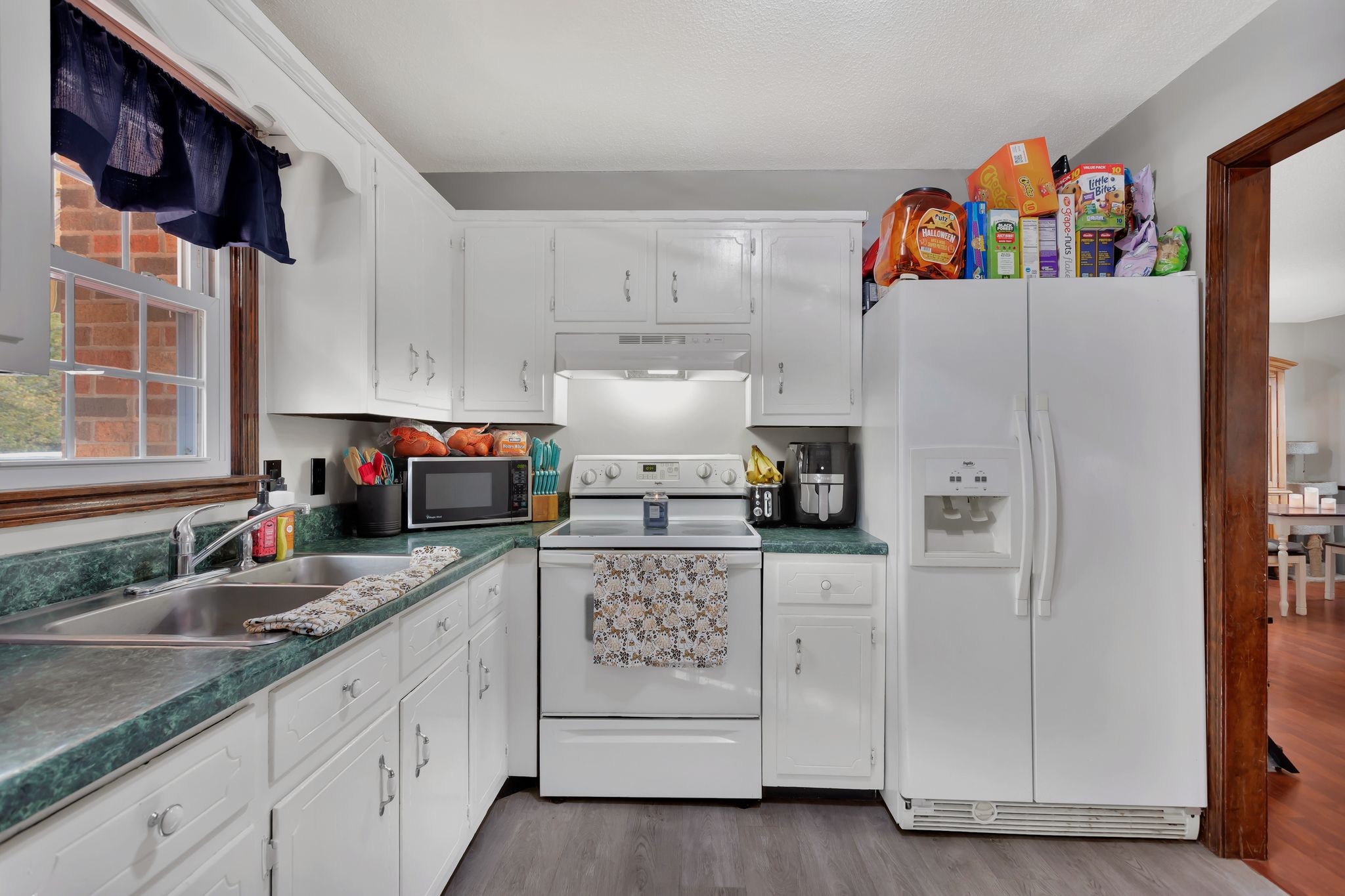 108 8th Avenue Columbia, TN 38401 - Photo 22 of 30 a kitchen with stainless steel appliances granite countertop a refrigerator and a sink