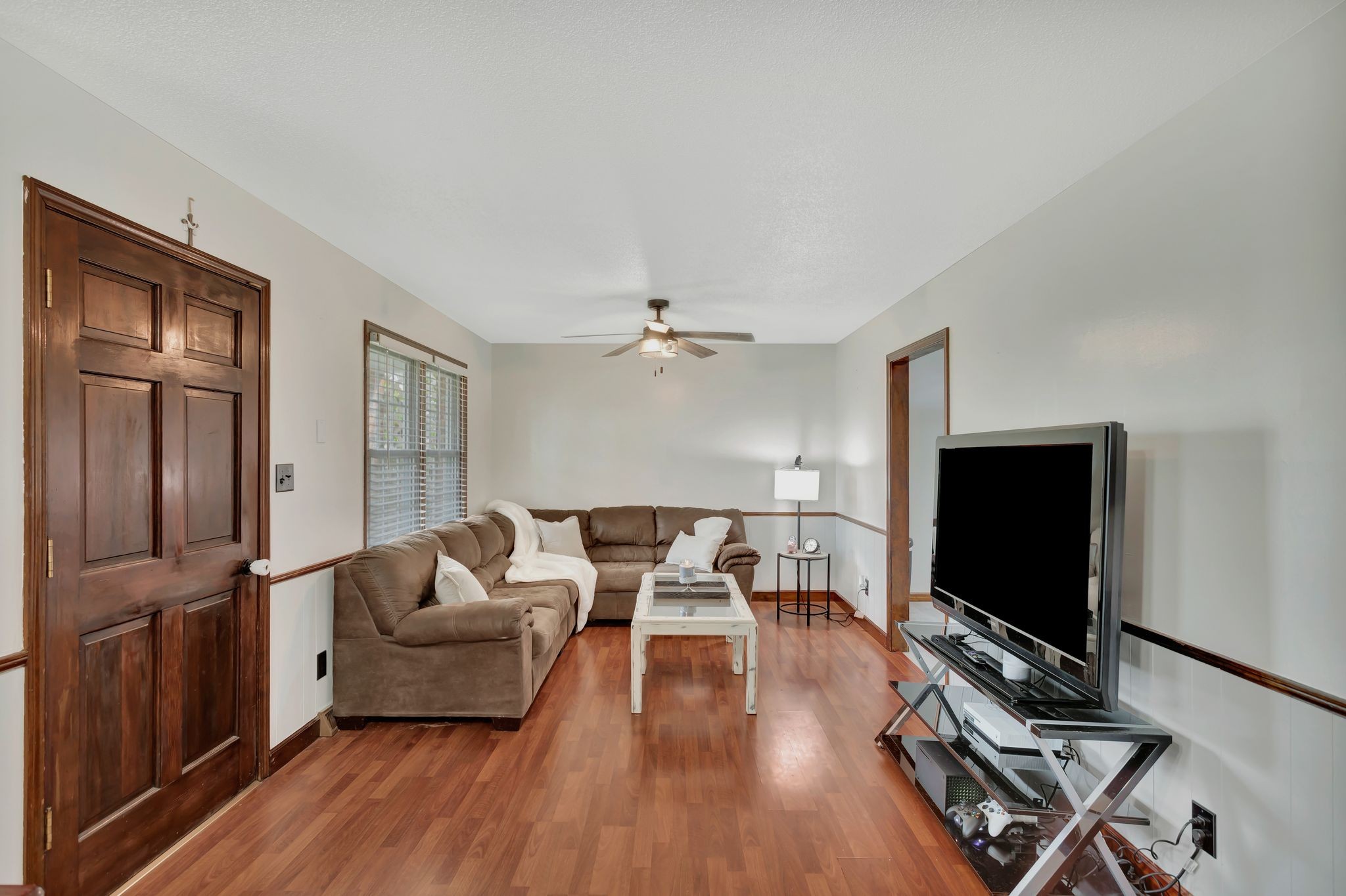 108 8th Avenue Columbia, TN 38401 - Photo 26 of 30 a living room with furniture flat screen tv and wooden floor