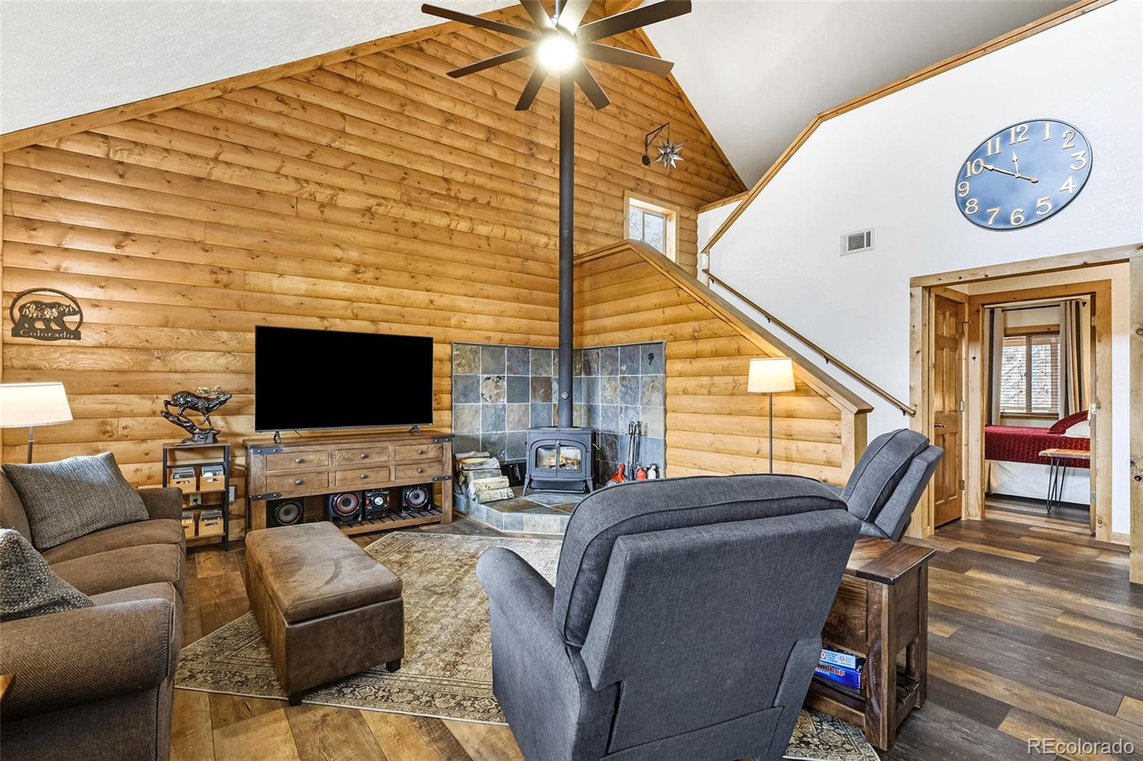 111 Twinkle Road Guffey, CO 80820 - Photo 12 of 39 a living room with furniture a flat screen tv and a fireplace