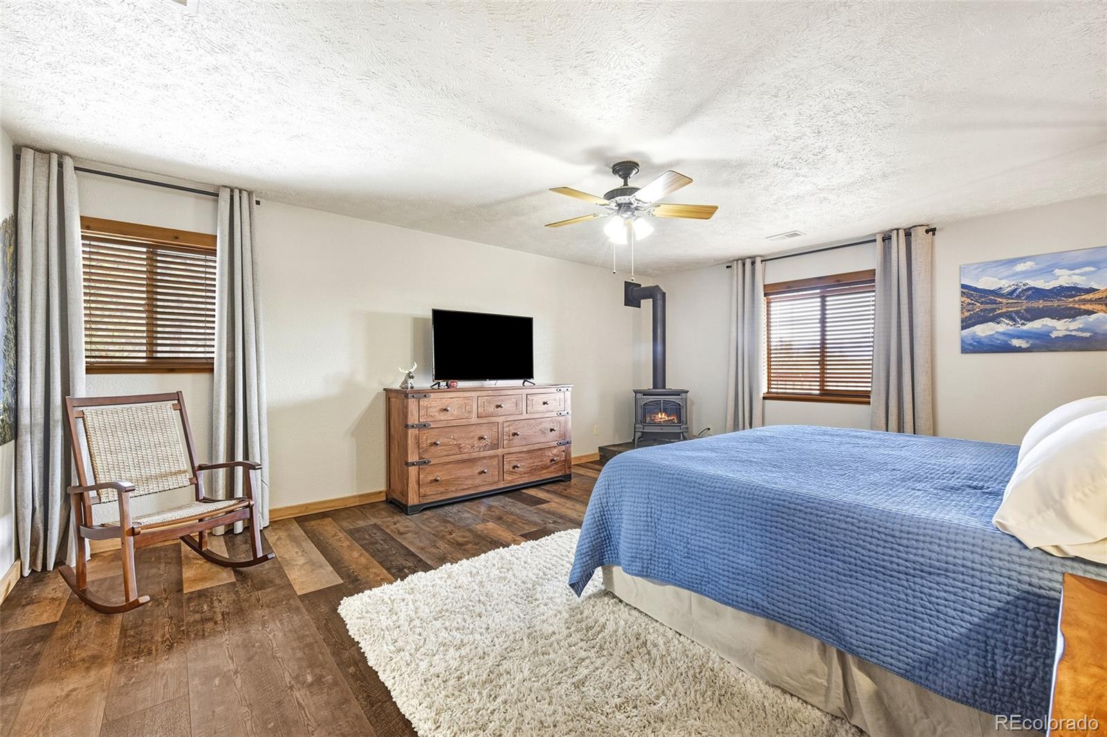 111 Twinkle Road Guffey, CO 80820 - Photo 20 of 39 a bedroom with a bed and a flat screen tv