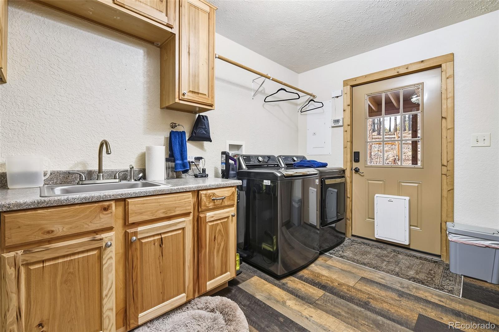 111 Twinkle Road Guffey, CO 80820 - Photo 24 of 39 a kitchen with stainless steel appliances granite countertop a stove a sink and a refrigerator