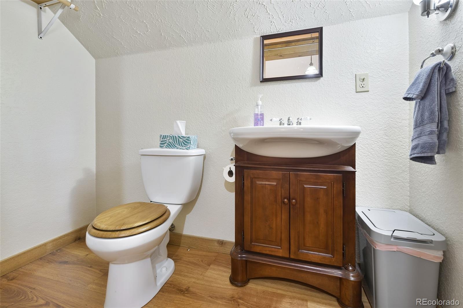 111 Twinkle Road Guffey, CO 80820 - Photo 31 of 39 a bathroom with a toilet and a sink