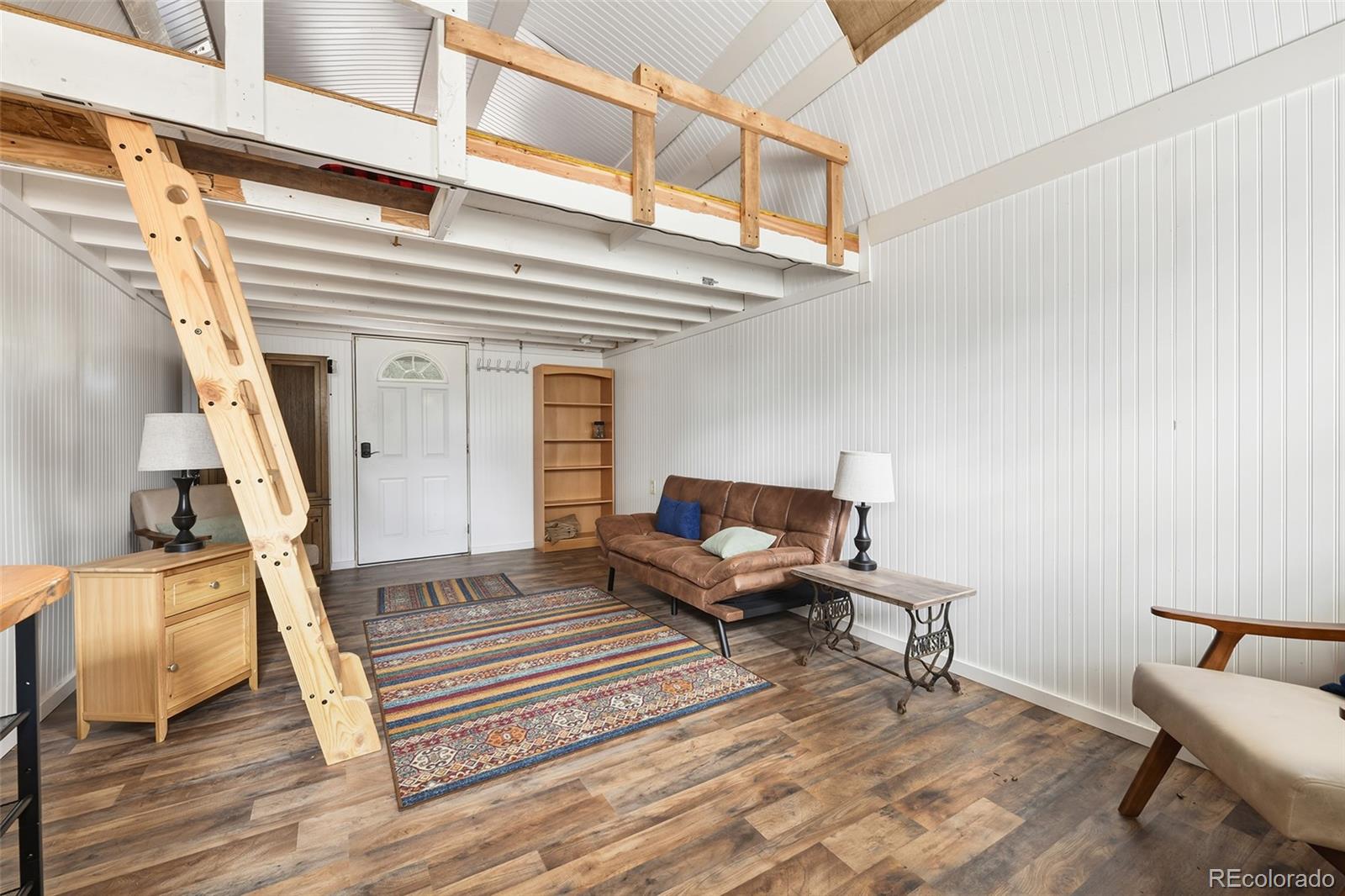 111 Twinkle Road Guffey, CO 80820 - Photo 34 of 39 a living room with furniture and a rug