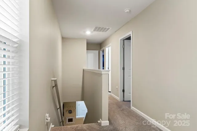 a view of a hallway with closet