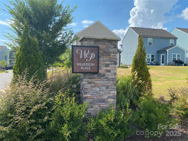 a sign board in front of a building