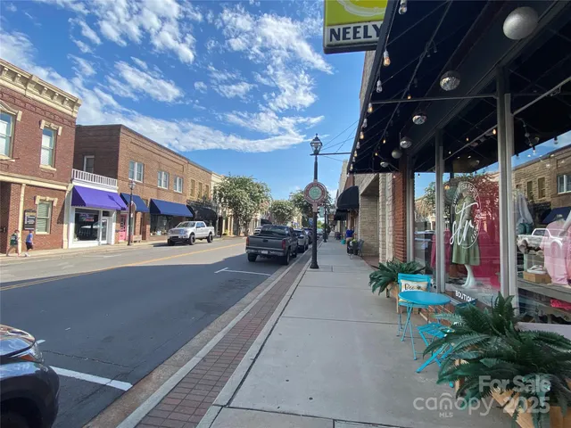 a couple of cars parked in front of building