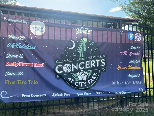 a sign that is on a brick wall