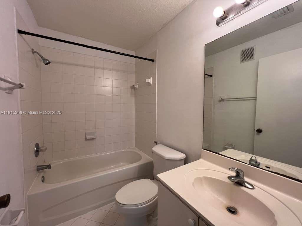 1261 Southeast 31st Court, Unit 20453 Homestead, FL 33035 - Photo 13 of 15 a bathroom with a sink toilet and shower