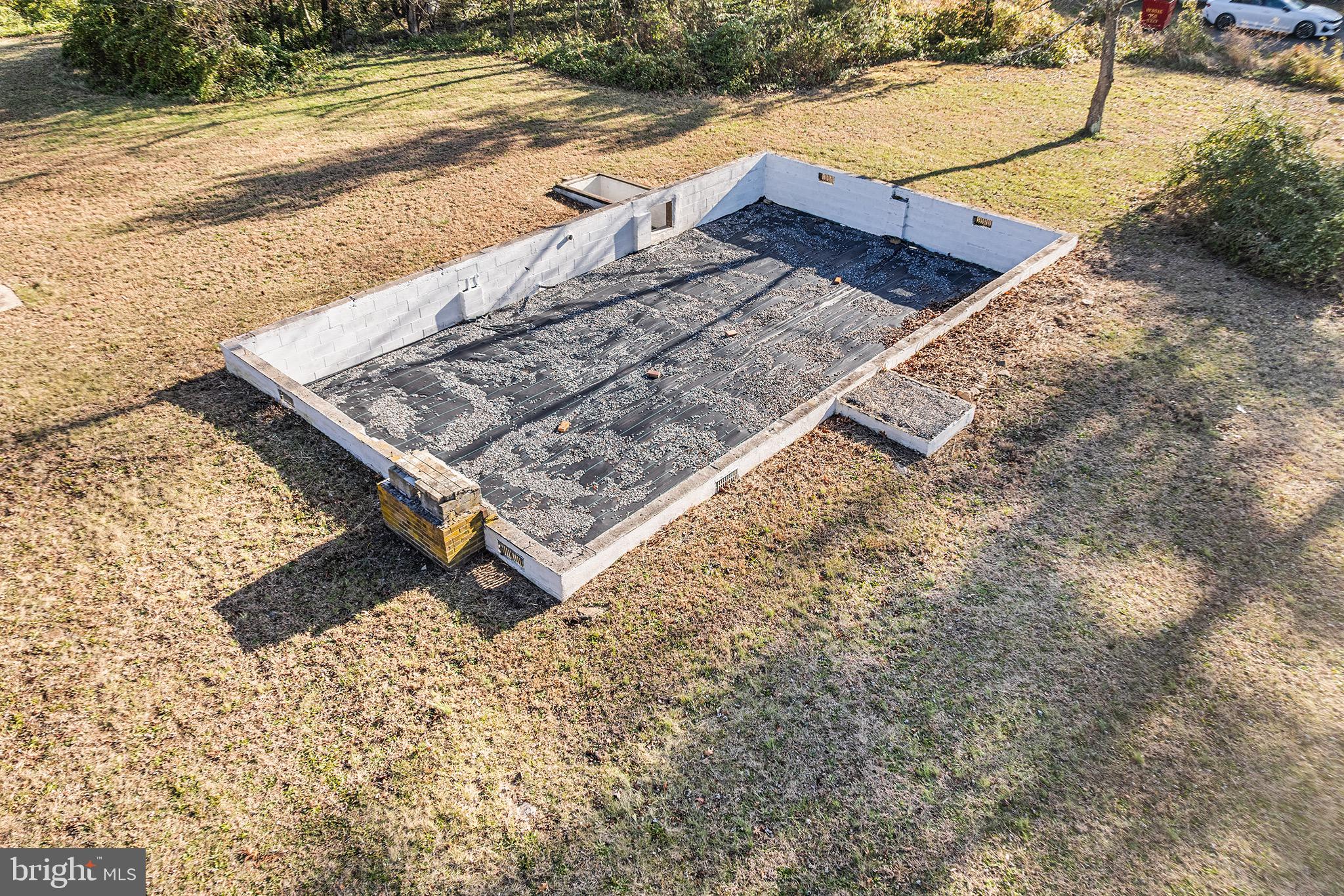 610 Buck Road Pittsgrove, NJ 08318 - Photo 4 of 19 a wooden bench sitting in the middle of a yard