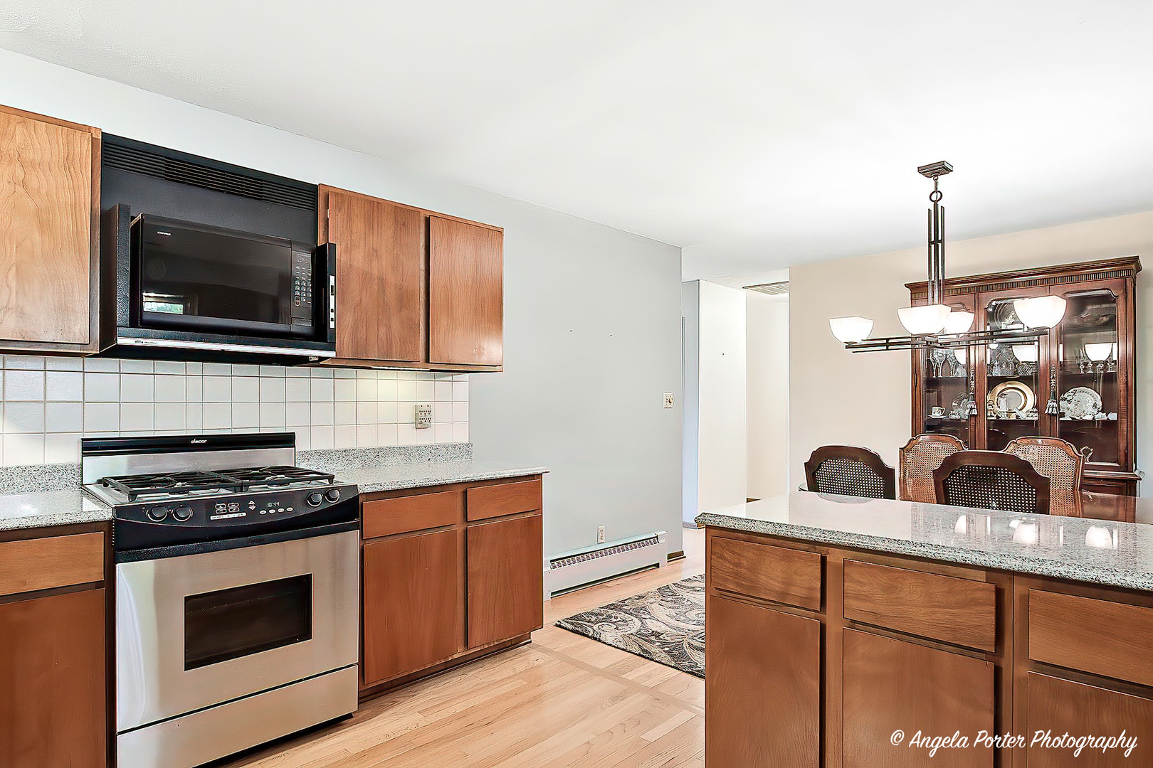 N613 County Rd U Genoa City, WI 53128 - Photo 5 of 22 a kitchen with stainless steel appliances a stove sink and microwave