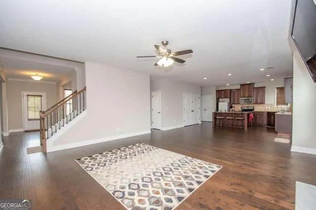 a view of kitchen and dining room with wooden floor