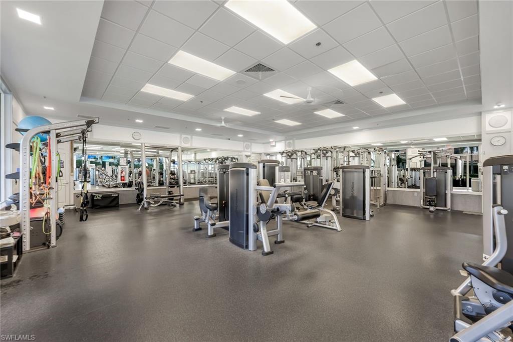 3108 Dominica Way Naples, FL 34119 - Photo 34 of 39 Fitness center featuring Cybex, TRX, dumbbells, kettlebells, Bosu.