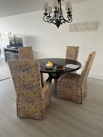 a dining room with furniture and wooden floor