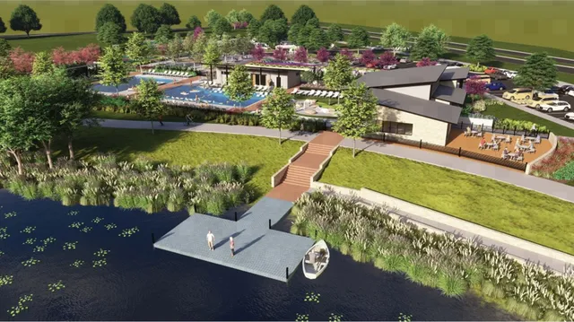 an aerial view of a house with a garden lake view