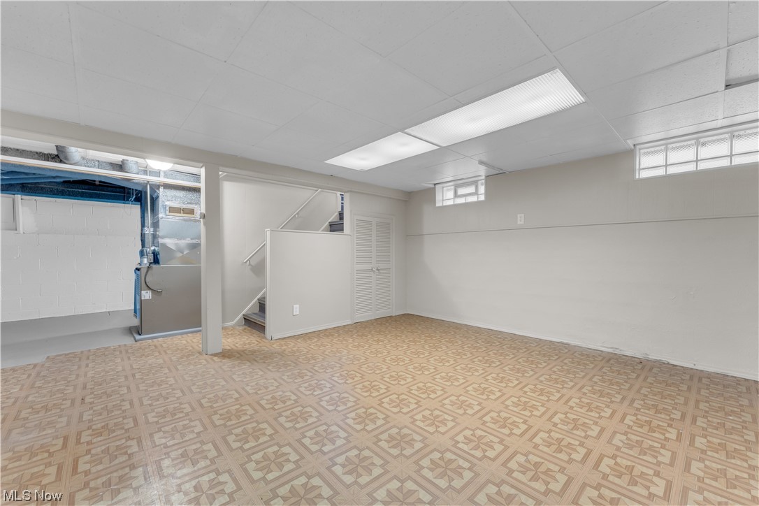 16301 Turney Road Maple Heights, OH 44137 - Photo 26 of 35 Basement featuring a drop ceiling and light tile flooring
