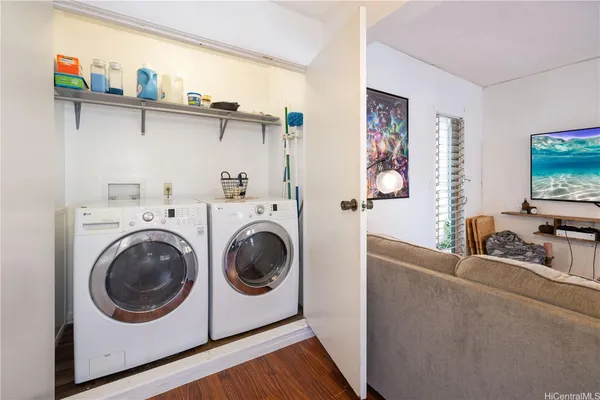 a view of living room with washer and dryer